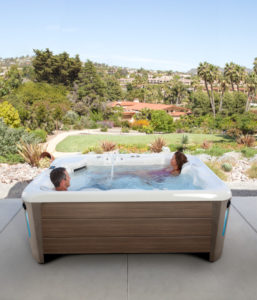 Hot Spring-Highlife-2019-Sovereign-Alpine White-Walnut-Lifestyle-Couple-02